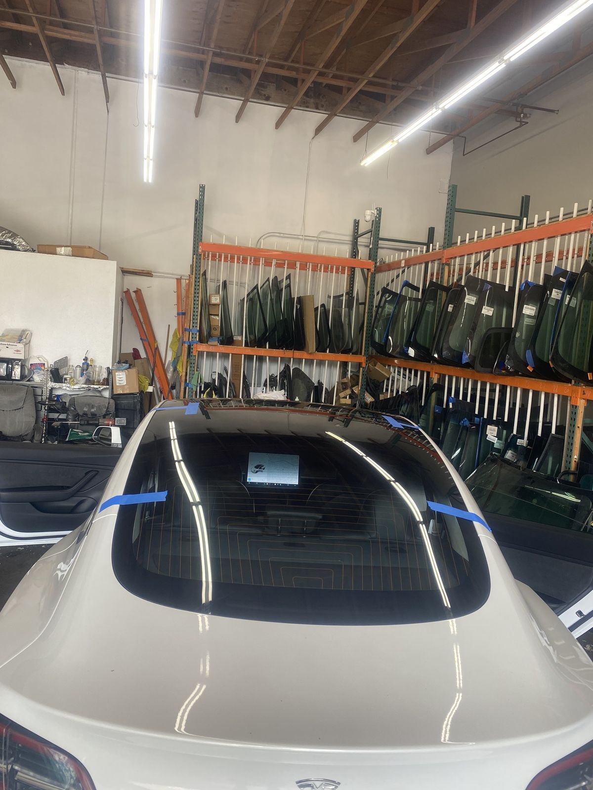 Windshield install in progress in the shop